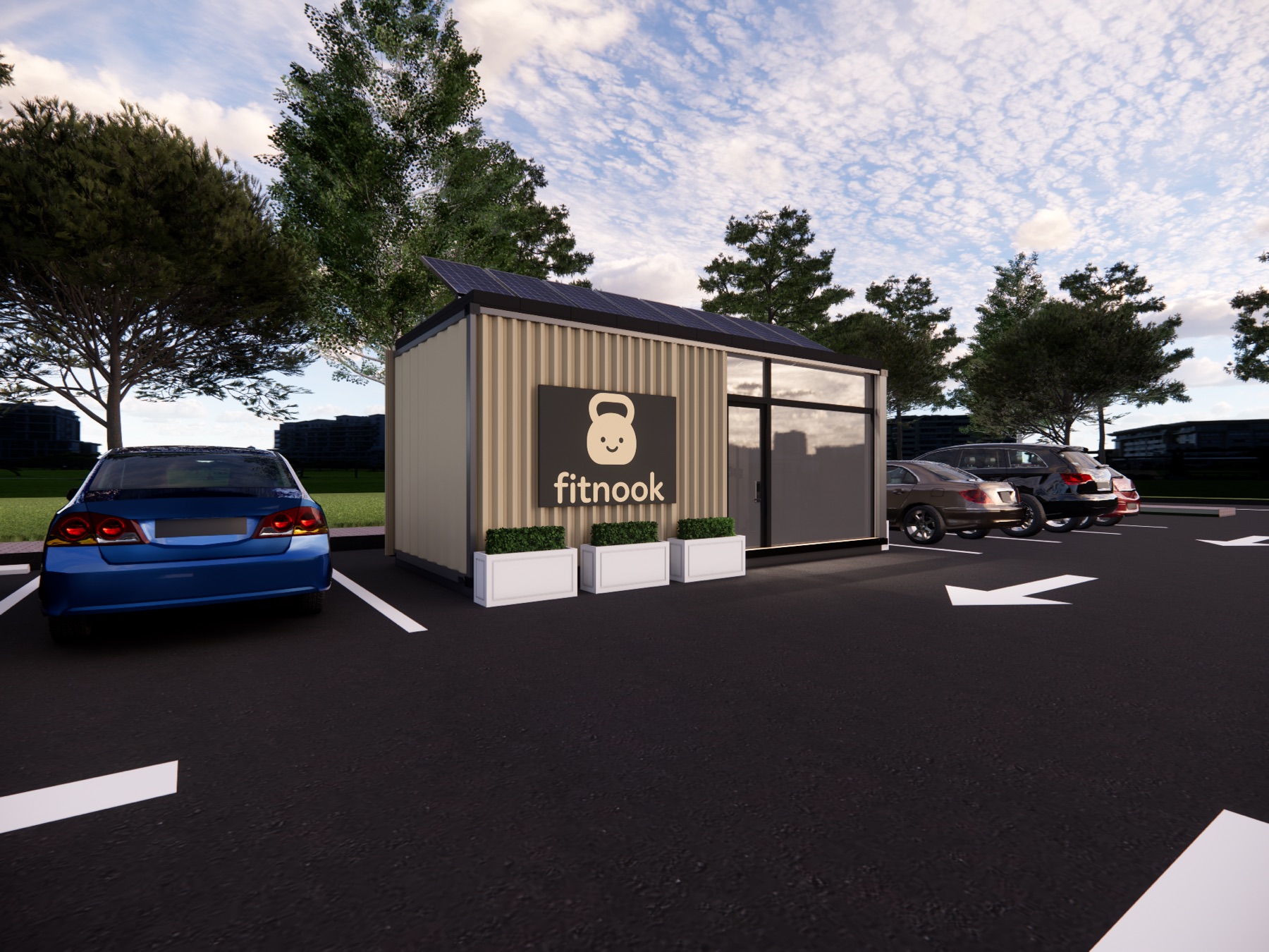 A fitnook pod parked in a lot under an open sky, glass front revealing the gym interior